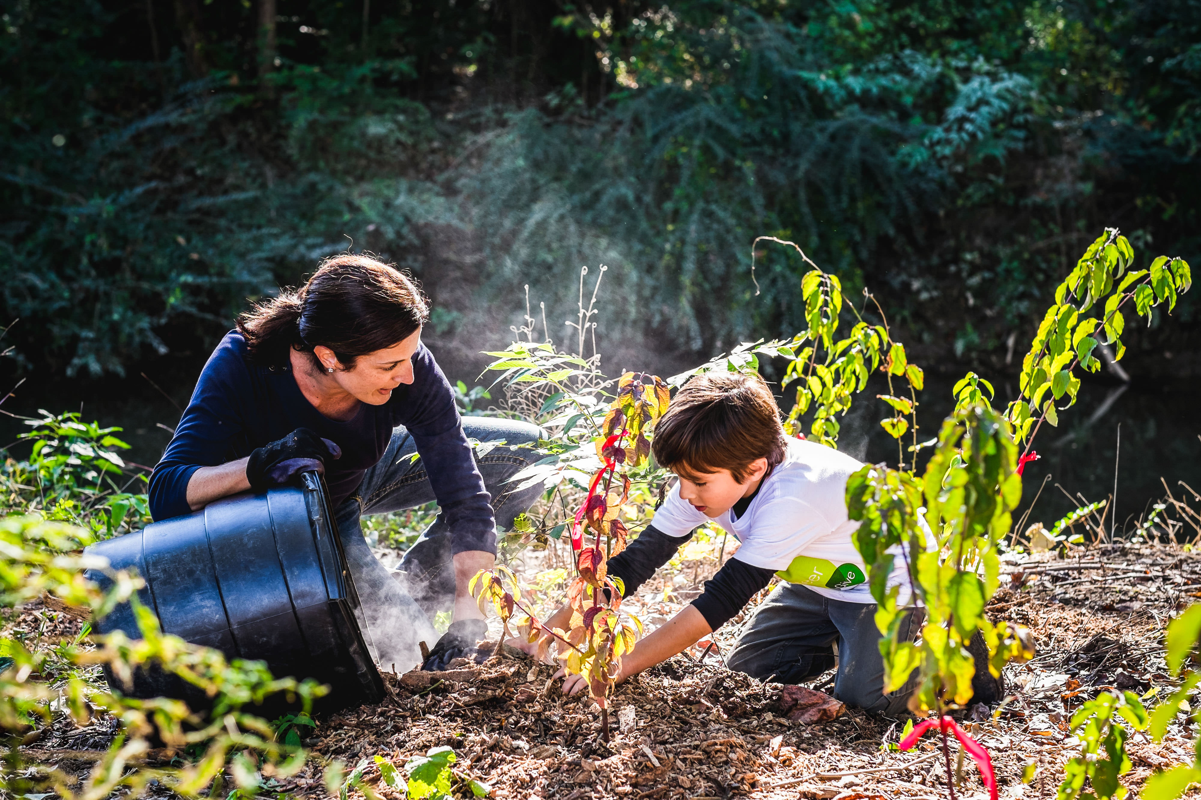 Mum and child gardening